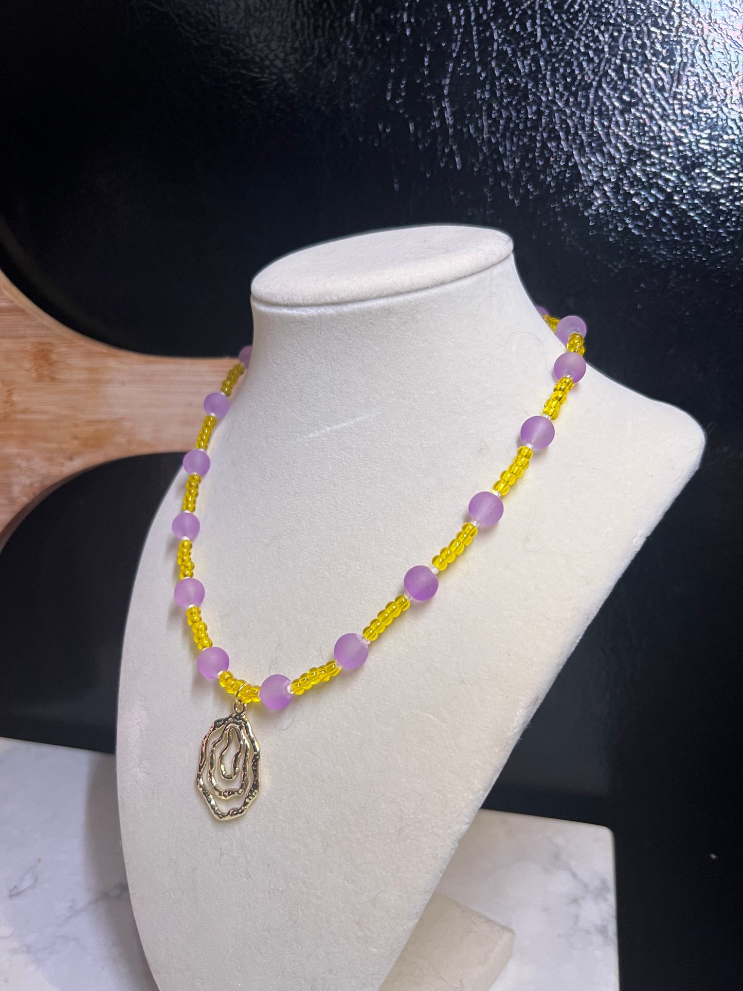 Yellow and purple beaded necklace
