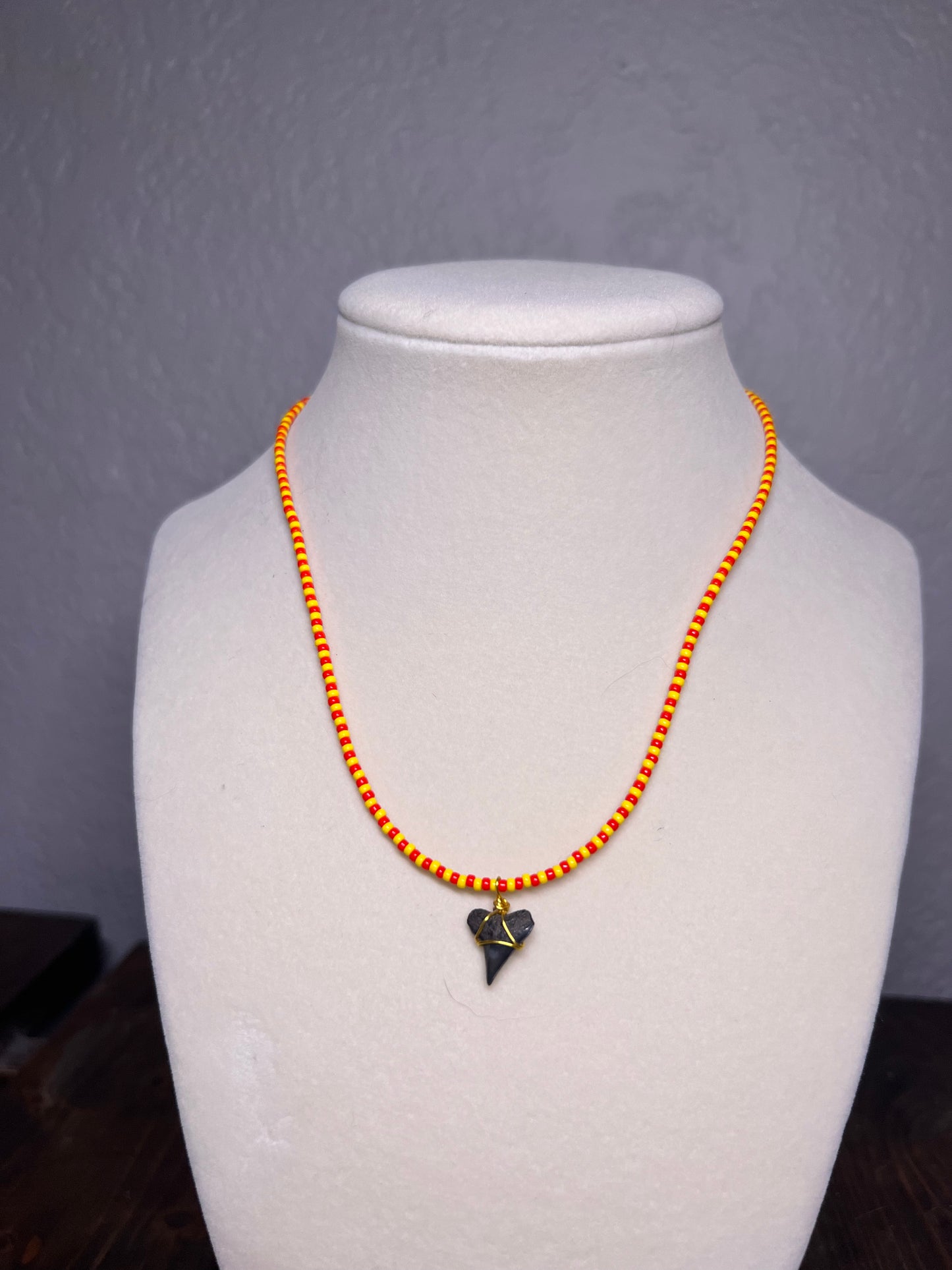 Yellow & red beaded necklace with wire wrapped sharks tooth