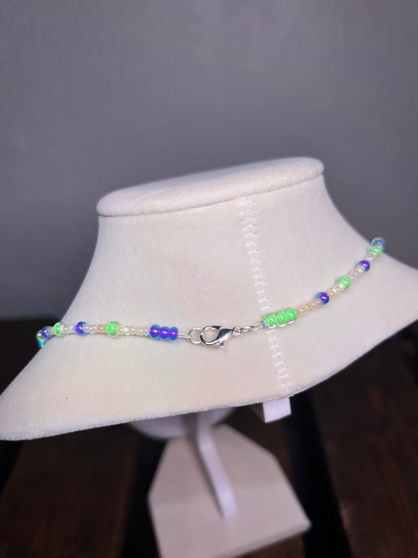 Purple and green glass bead necklace