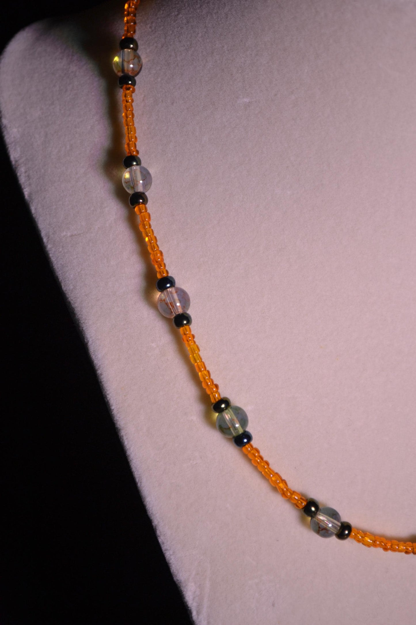 Multicolor glass bead necklace. Orange, black, and topaz.