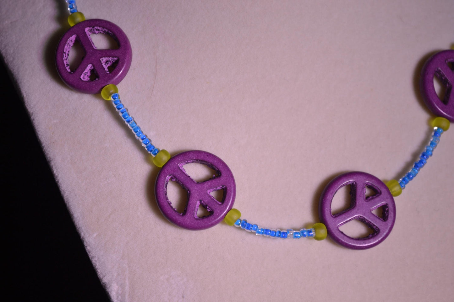 Multicolor glass bead necklace. Peace sign, blue, and green