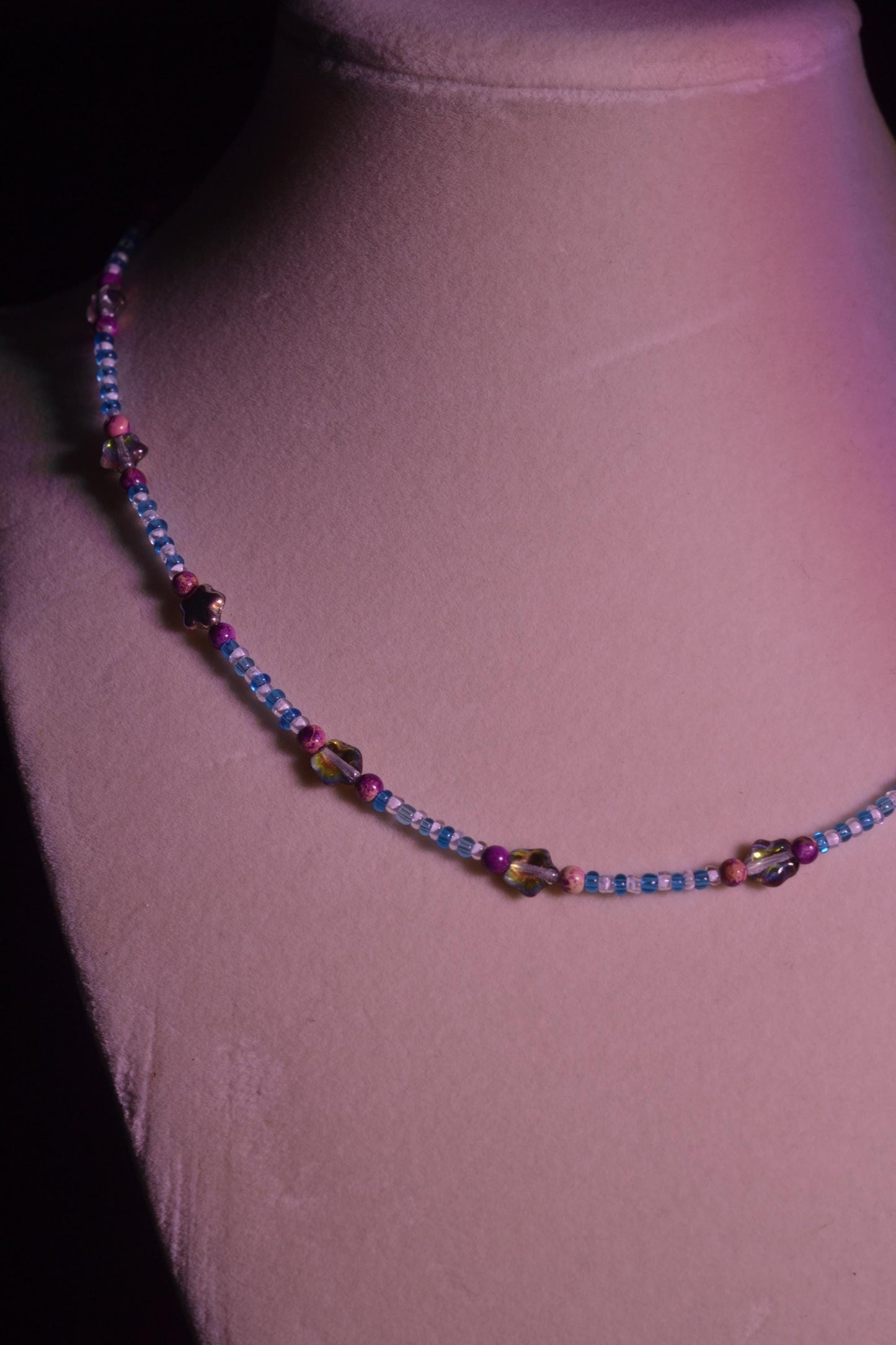 Multicolor glass bead necklace. Purple stars, blue, and white