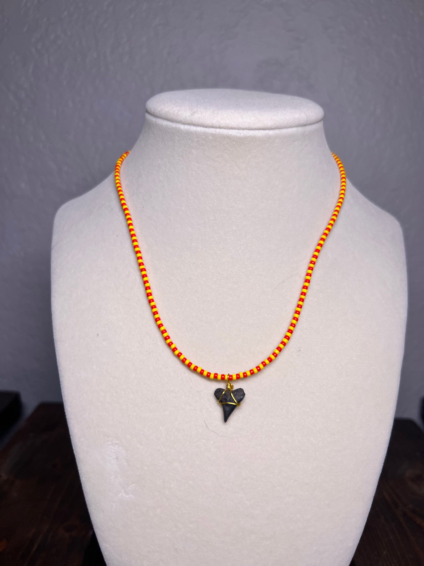 Yellow & red beaded necklace with wire wrapped sharks tooth