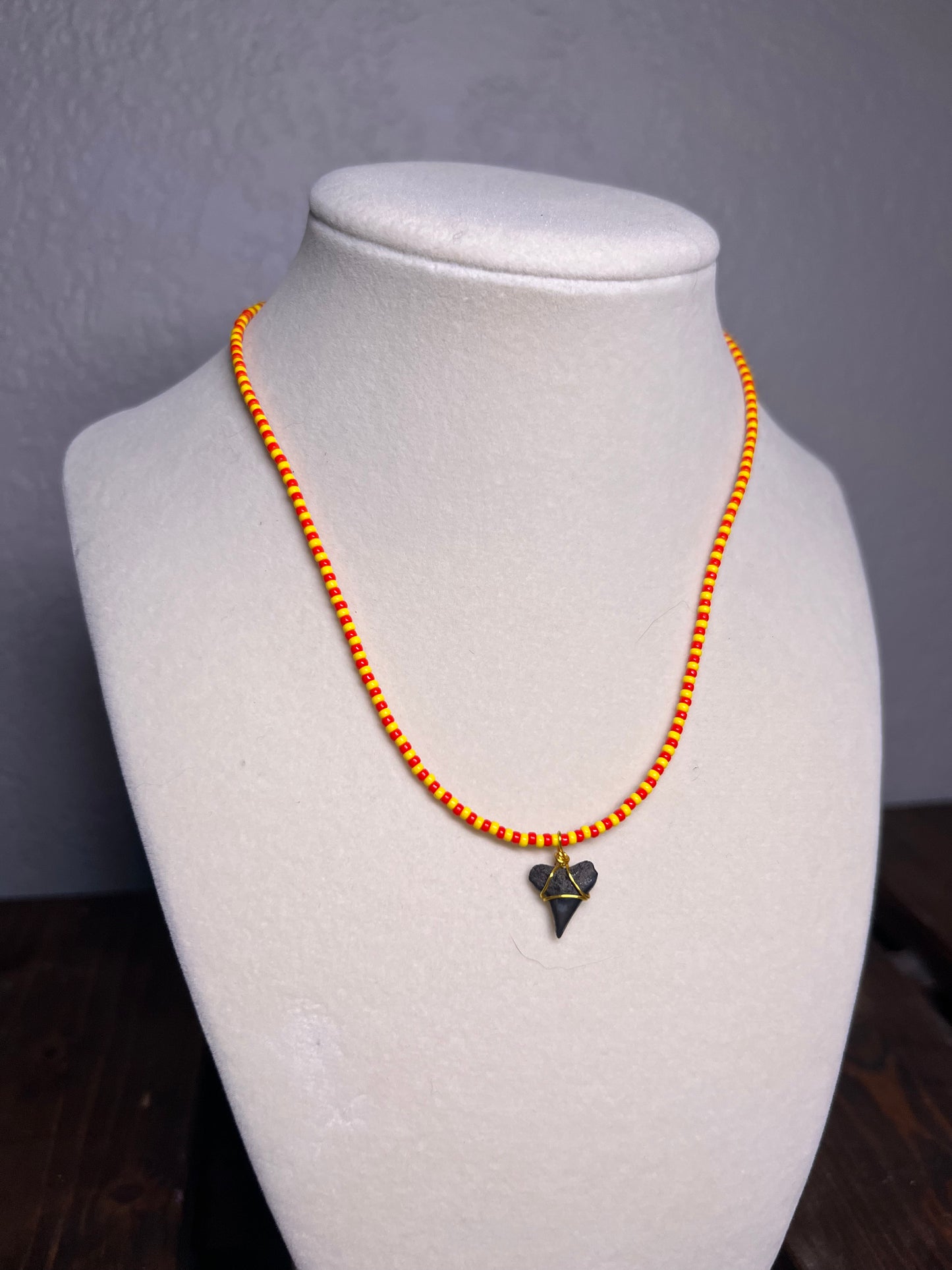 Yellow & red beaded necklace with wire wrapped sharks tooth