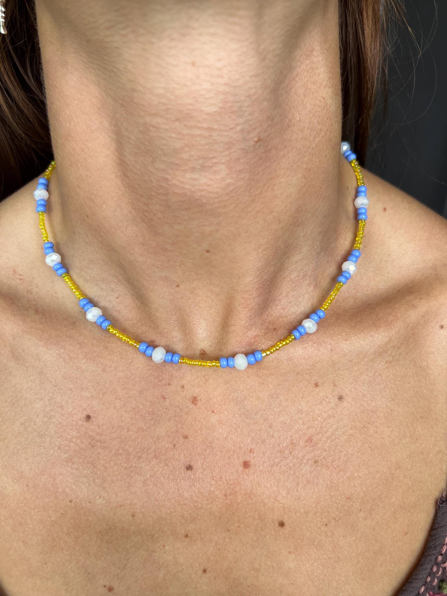 Multicolor glass bead necklace. Blue, yellow, and white.