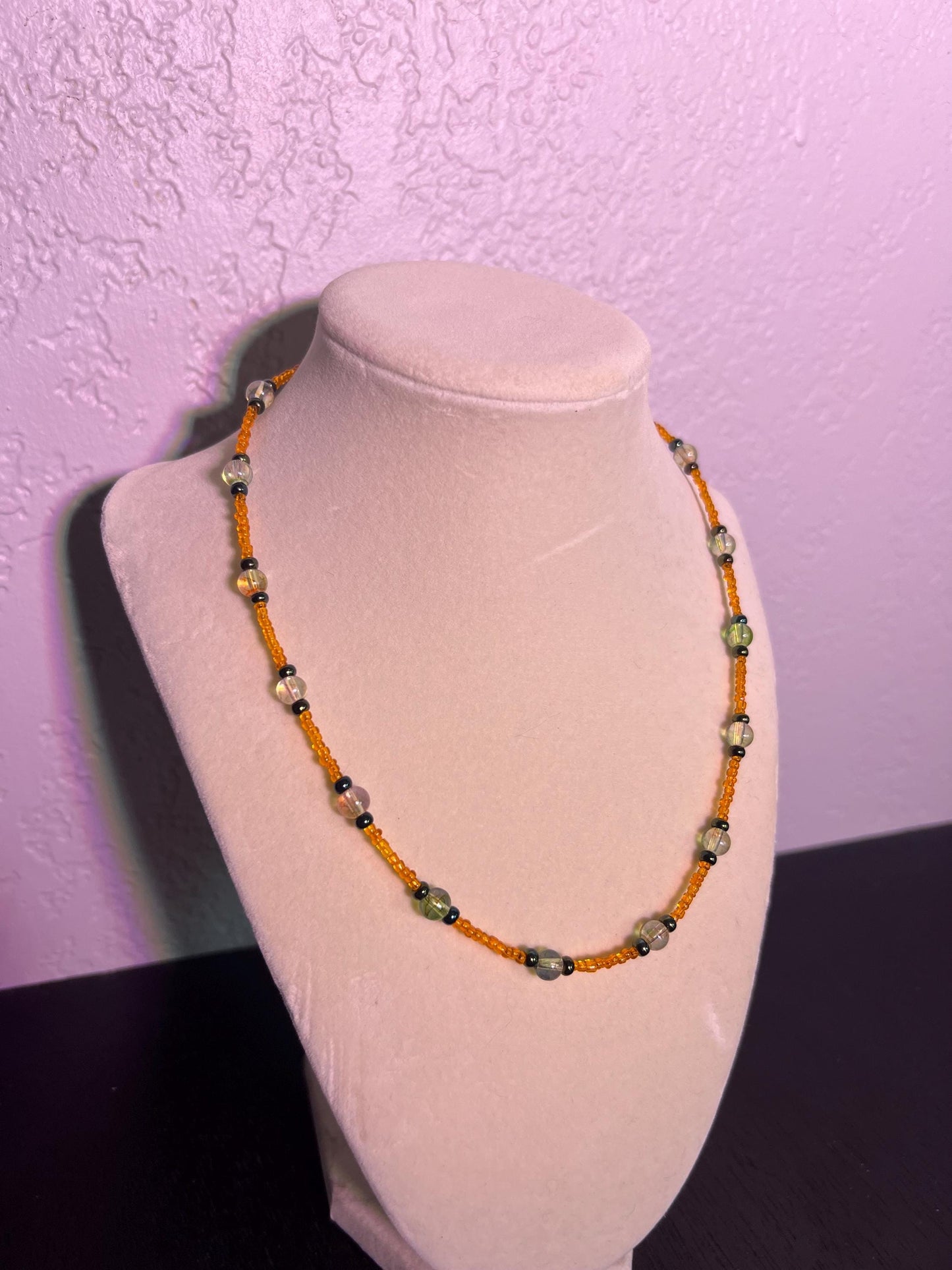 Multicolor glass bead necklace. Orange, black, and topaz.