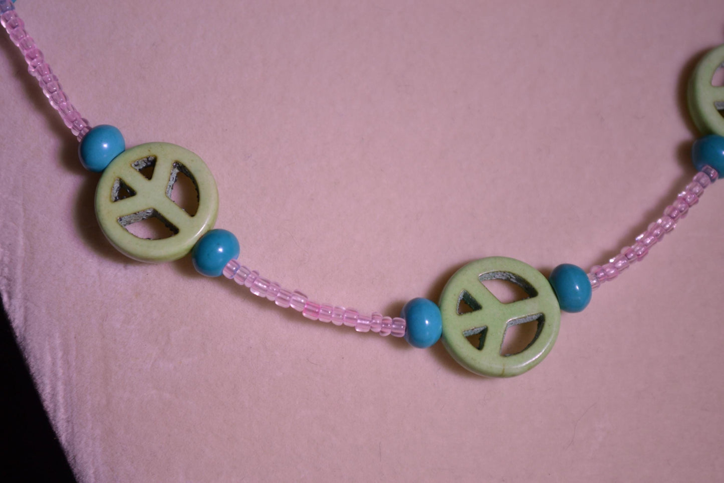 Multicolor glass bead necklace. Peace sign, turquoise, and pink