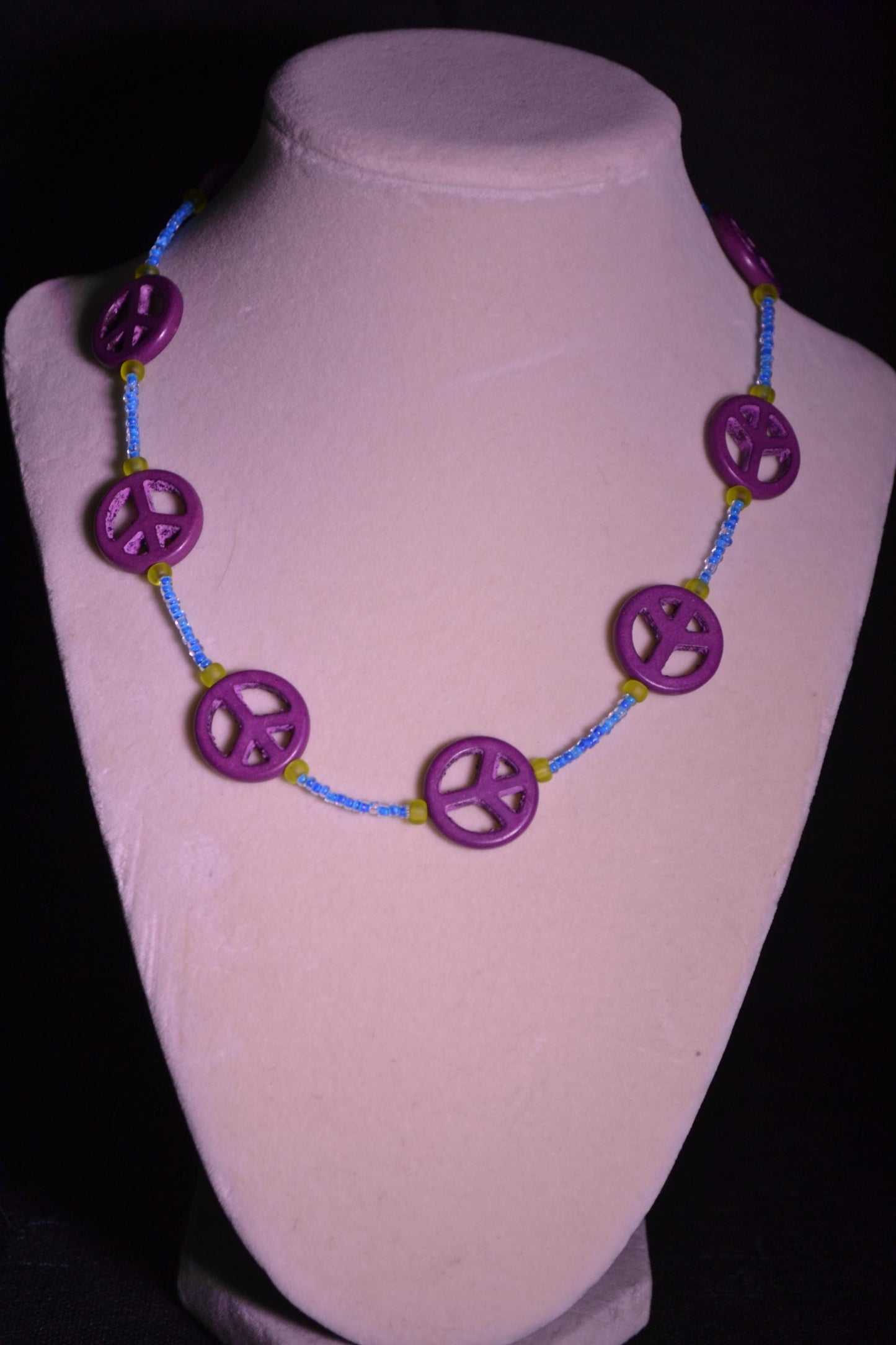 Multicolor glass bead necklace. Peace sign, blue, and green