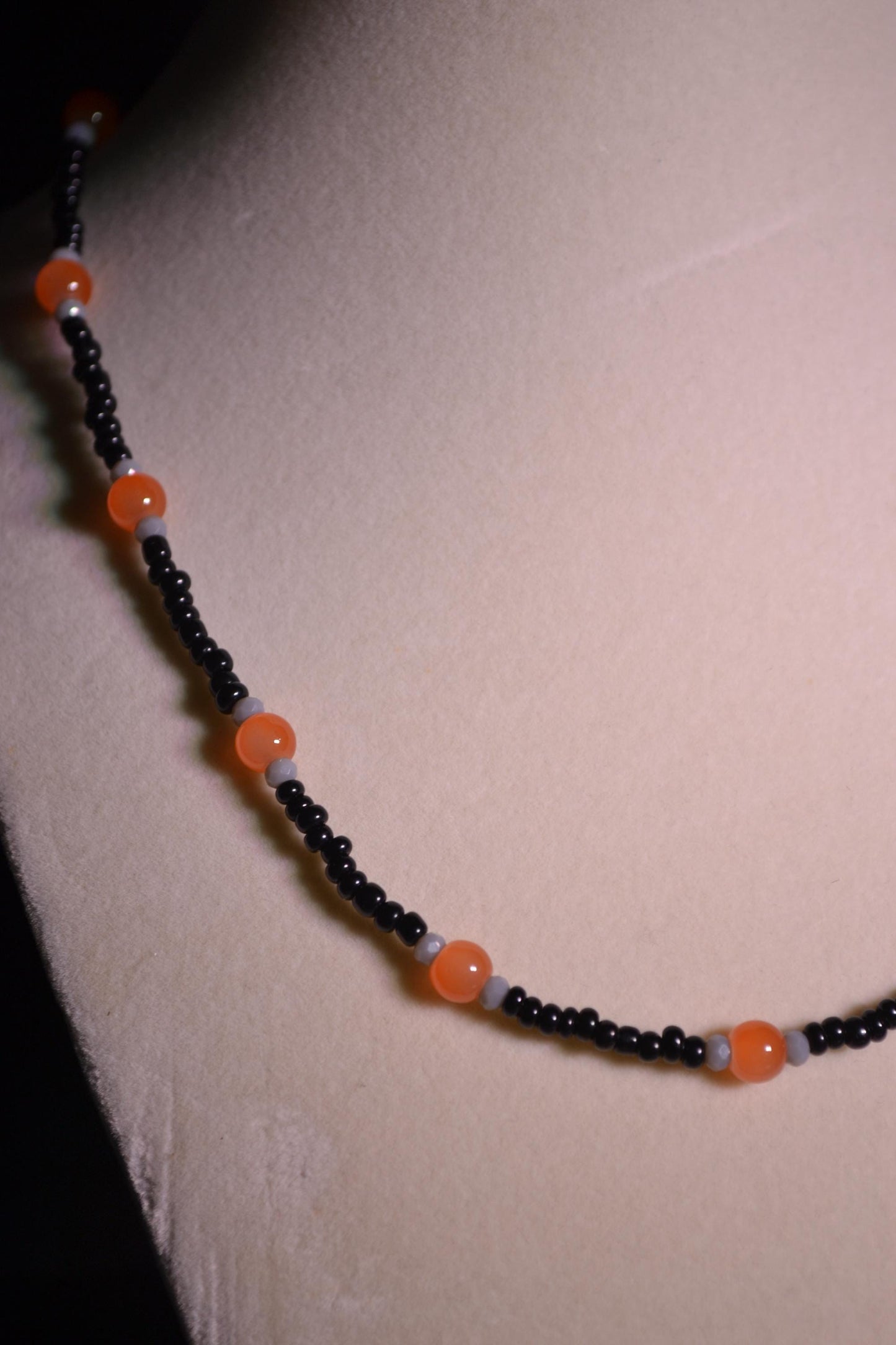 Orange, black, and gray glass bead necklace