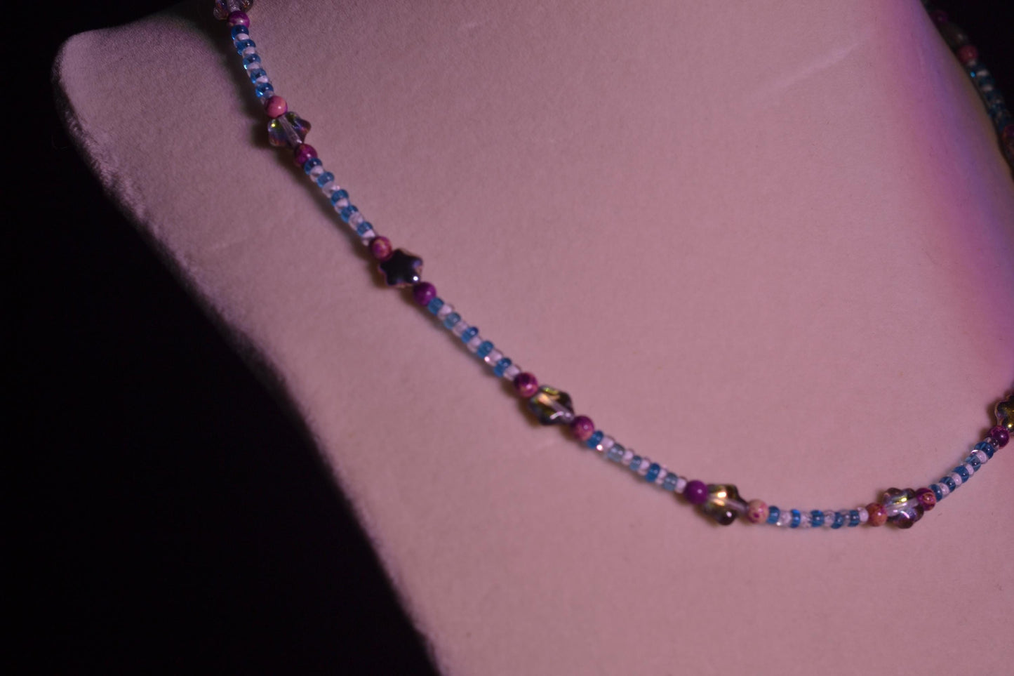 Multicolor glass bead necklace. Purple stars, blue, and white