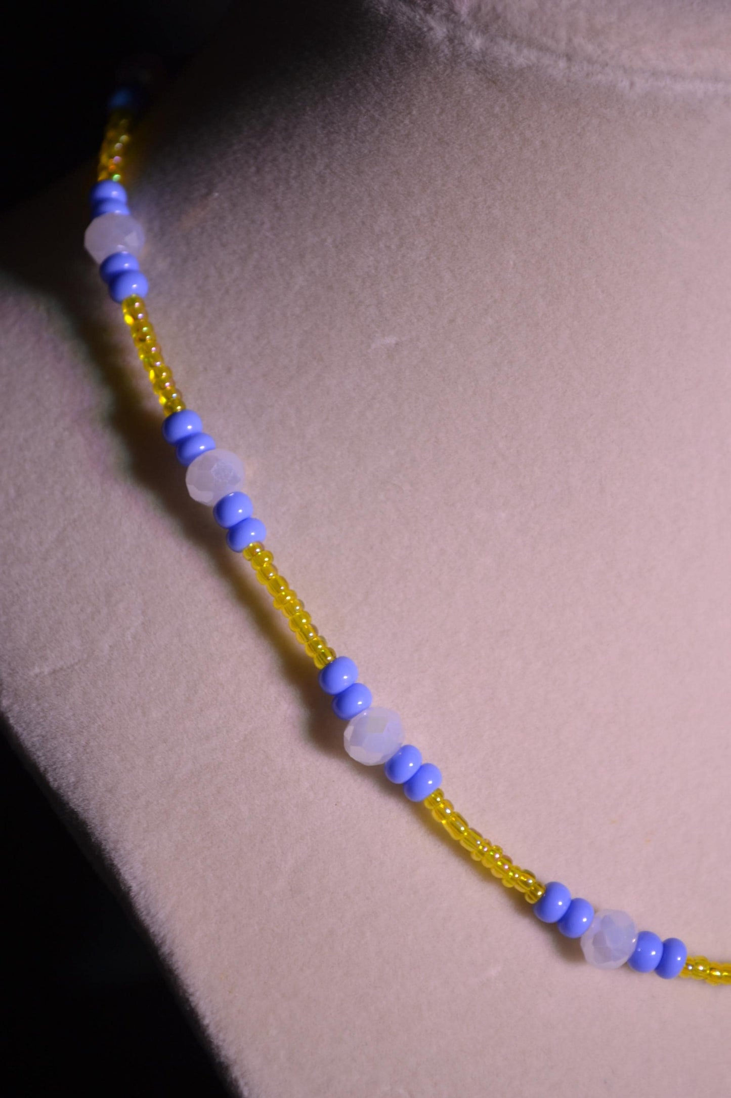 Multicolor glass bead necklace. Blue, yellow, and white.