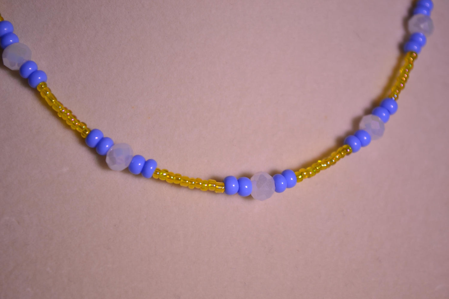 Multicolor glass bead necklace. Blue, yellow, and white.