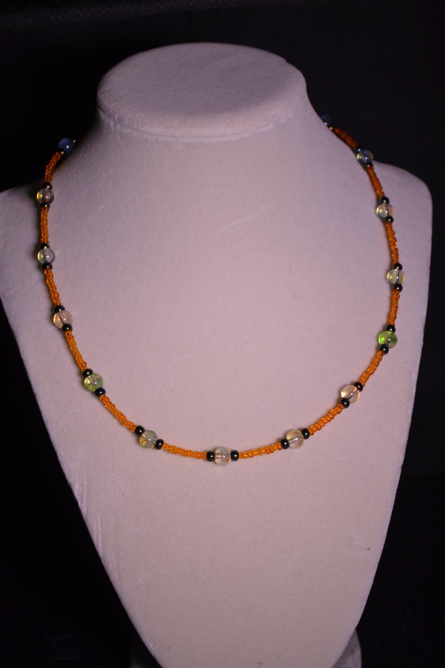 Multicolor glass bead necklace. Orange, black, and topaz.