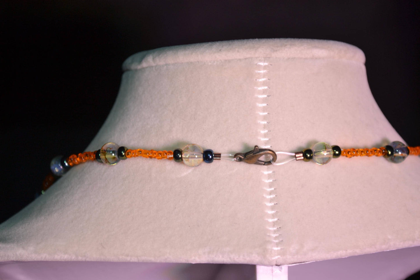 Multicolor glass bead necklace. Orange, black, and topaz.