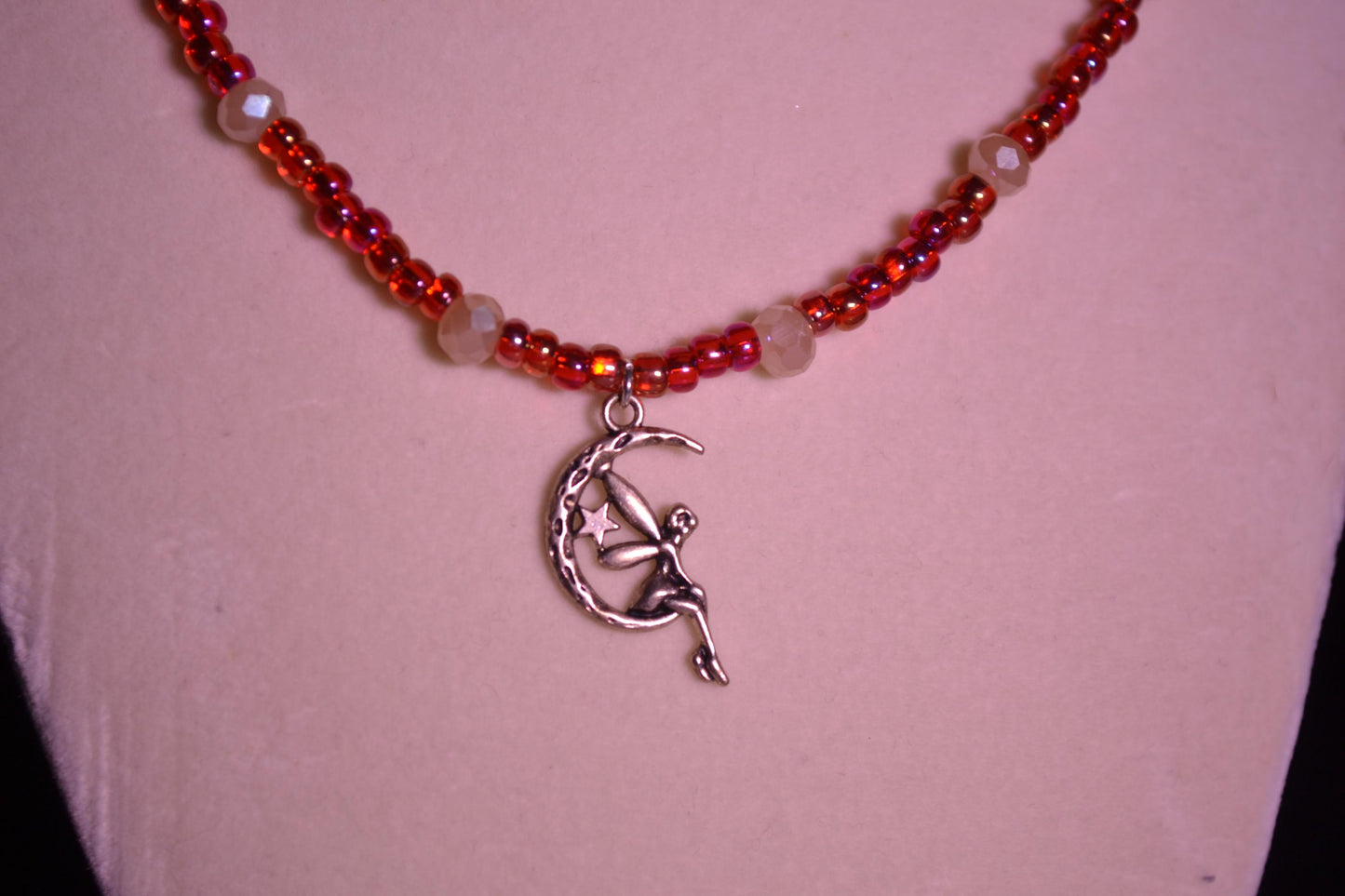 Glass bead necklace. Fairy pendant. Red and peachy pearl