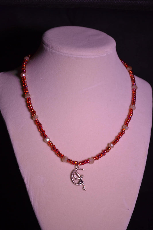 Glass bead necklace. Fairy pendant. Red and peachy pearl