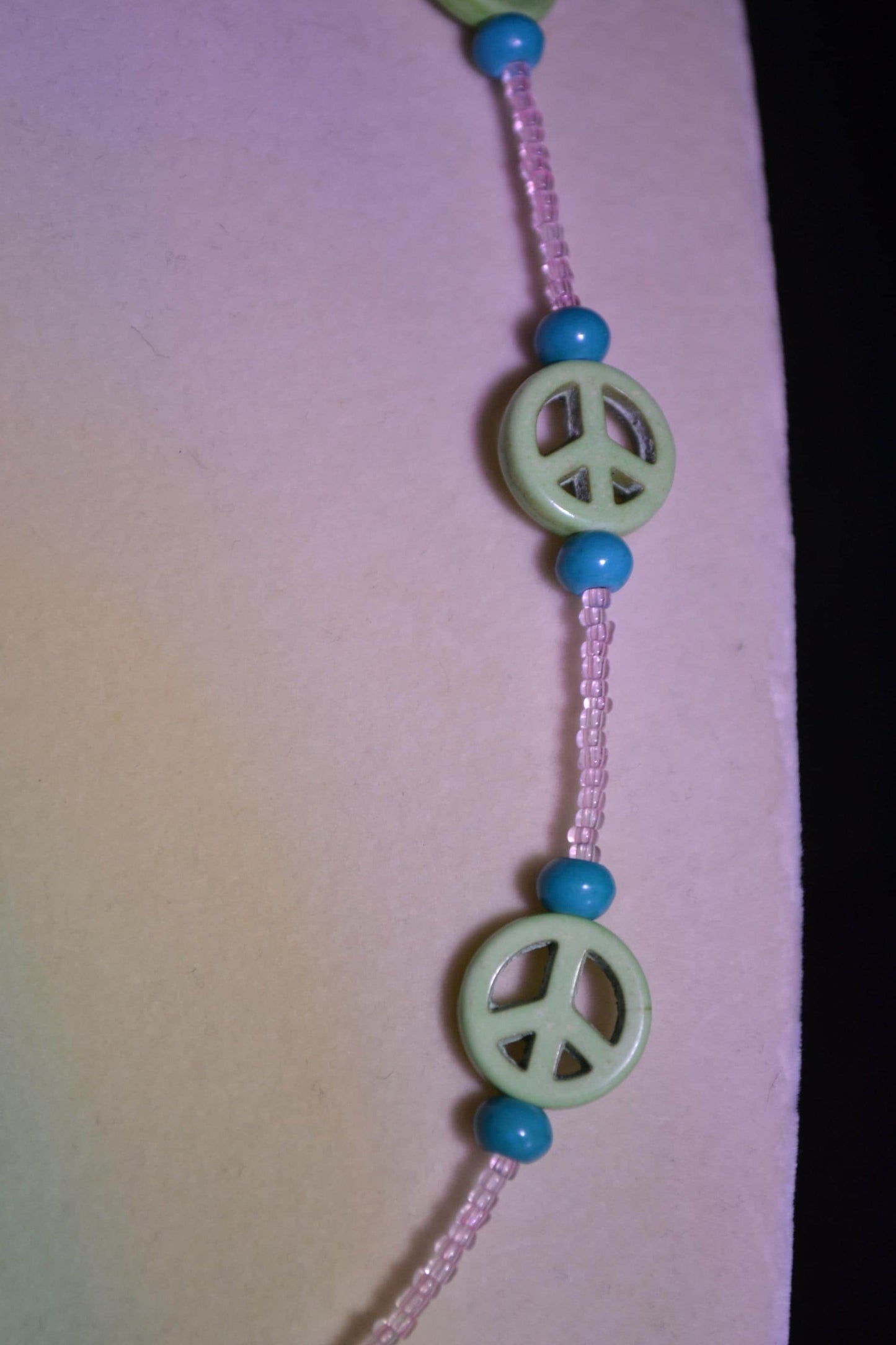 Multicolor glass bead necklace. Peace sign, turquoise, and pink