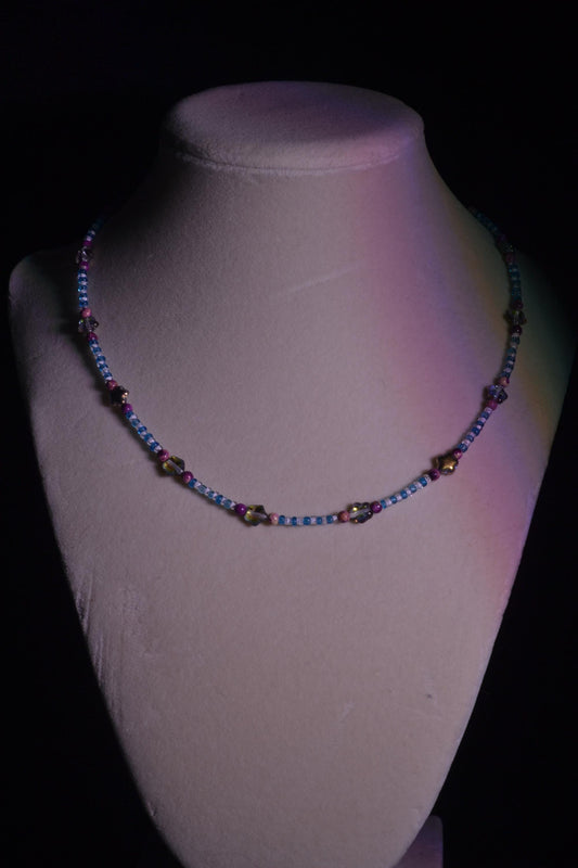 Multicolor glass bead necklace. Purple stars, blue, and white