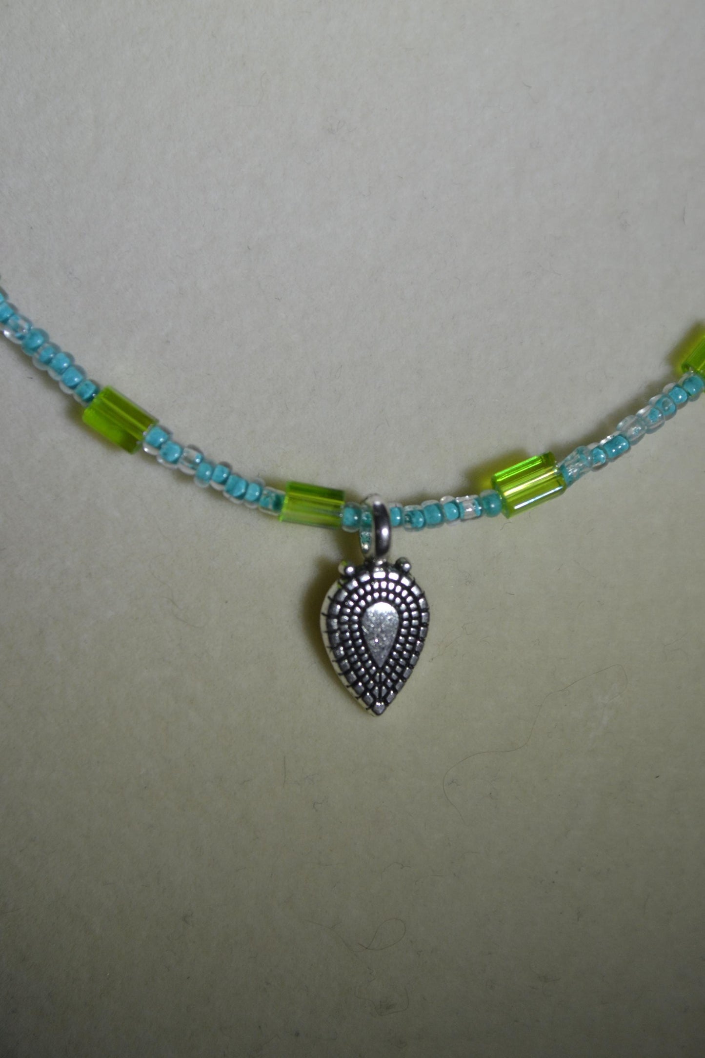 Silver arrow pendant glass bead necklace